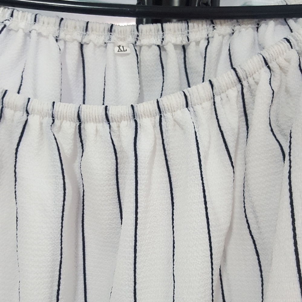 Black stripped white shirt.